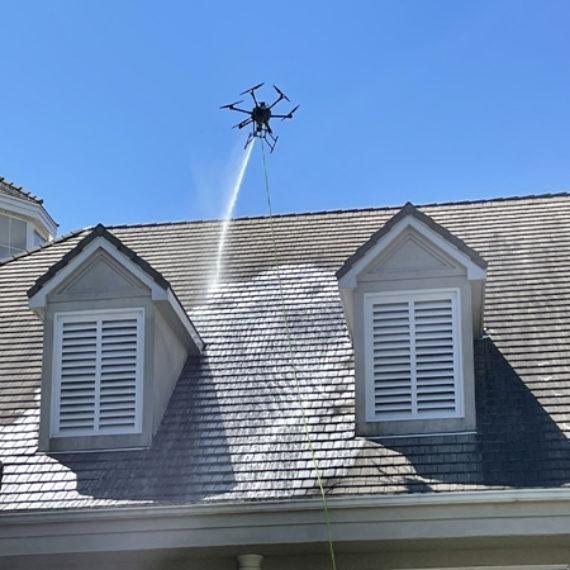 Softwashing roof with drone