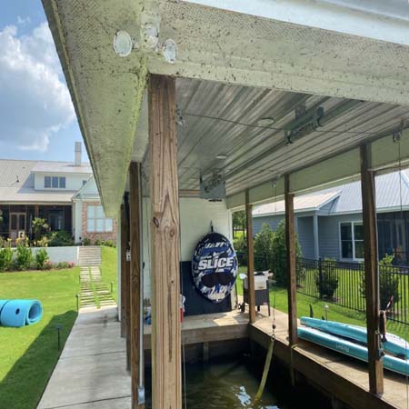 Softwashing boat house before and after